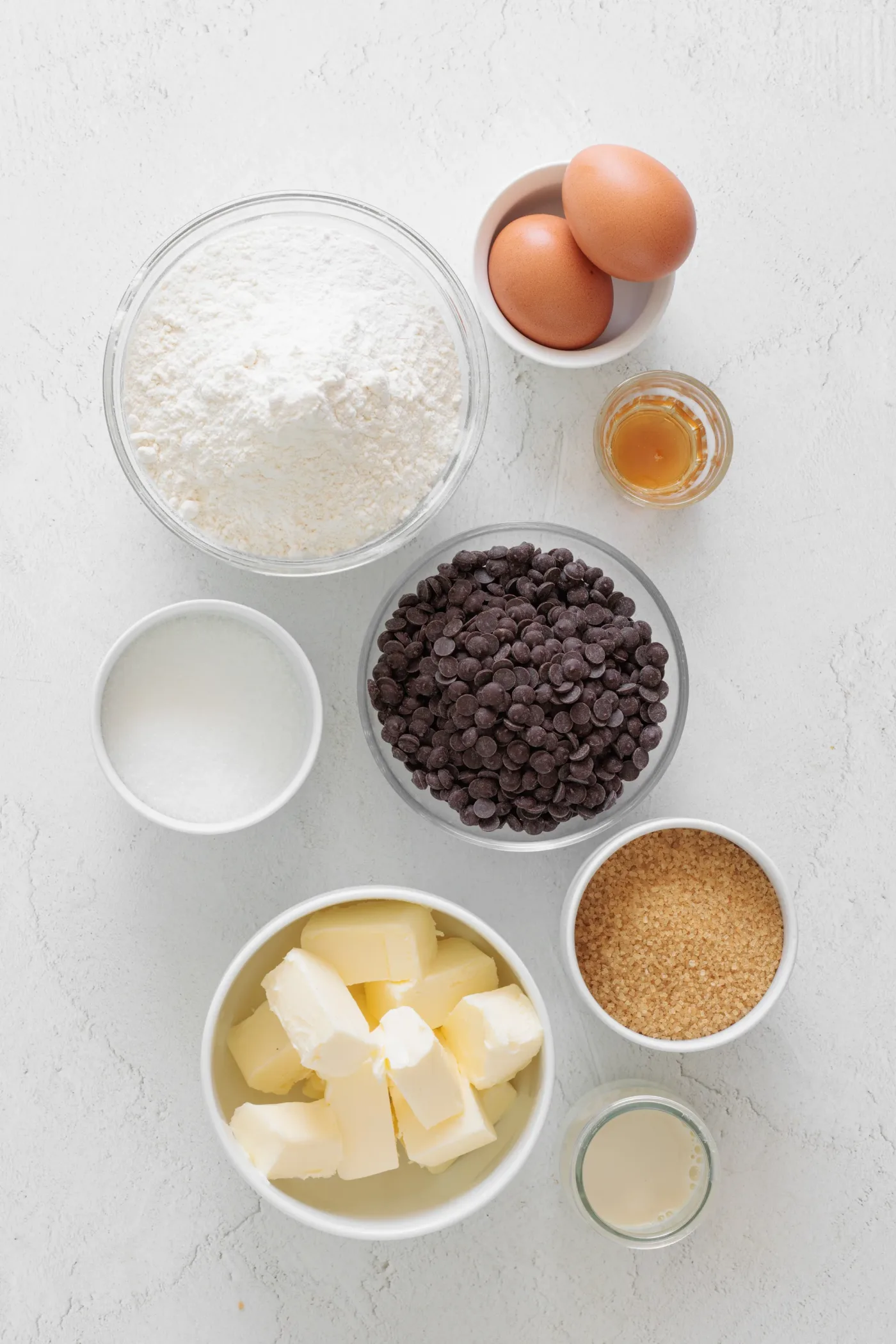 Measured butter, flour, eggs, sugars, milk, vanilla, and chocolate chips for brown butter cookies